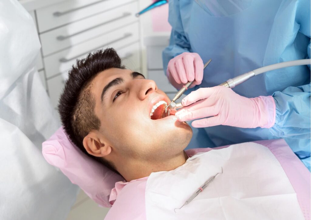Patient receiving a dental examination to diagnose a tooth infection before treatment.