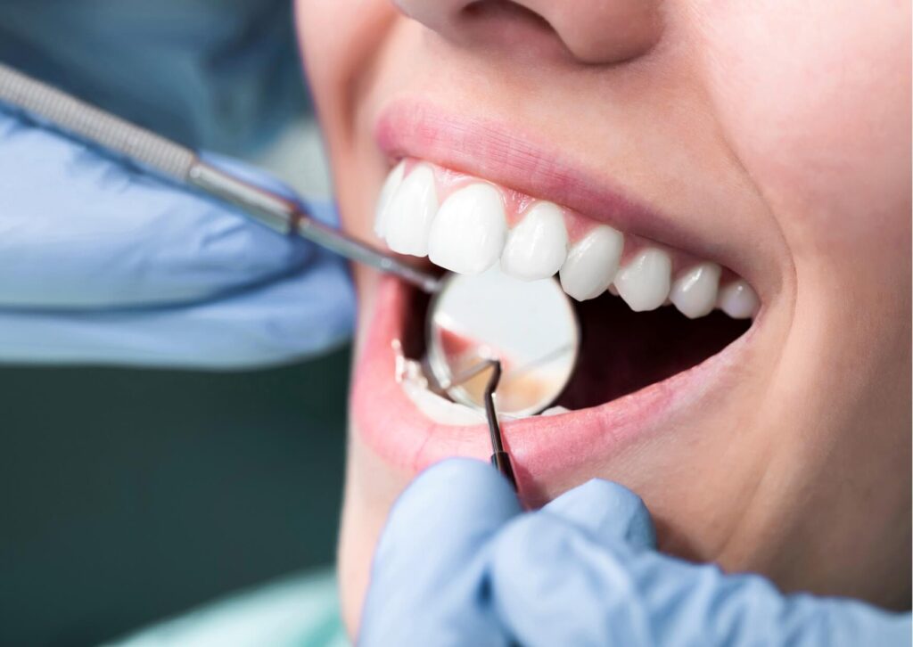 Patient receiving a cosmetic dental evaluation before veneers, a step that helps determine veneers cost by location and treatment needs.